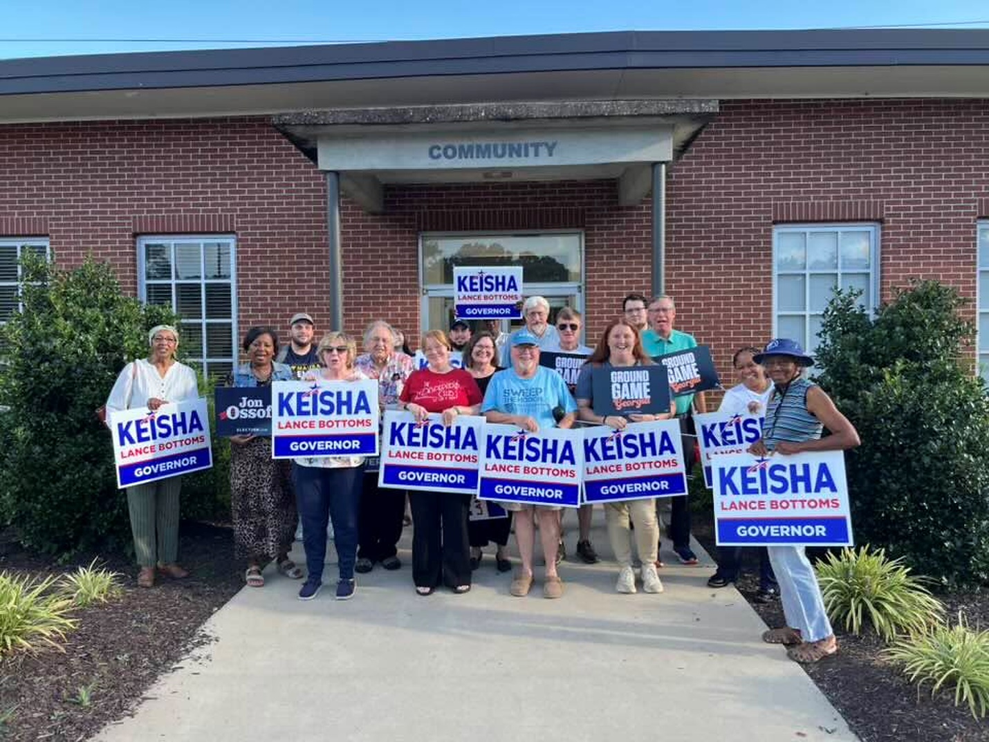 Troup Democrats group outside a building